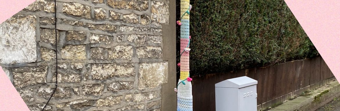Yarn bomb on lamp post and flower pot to illustrate a post by Yang-May Ooi, Knitwear for Lamp Posts, on the Oxford Moments Blog