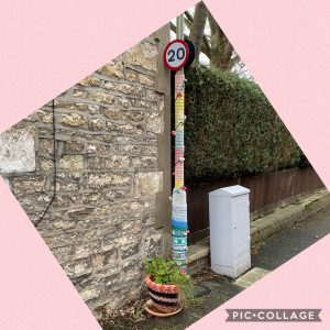 Yarn bomb on lamp post and flower pot to illustrate a post by Yang-May Ooi, Knitwear for Lamp Posts, on the Oxford Moments Blog