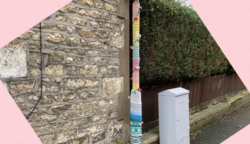 Yarn bomb on lamp post and flower pot to illustrate a post by Yang-May Ooi, Knitwear for Lamp Posts, on the Oxford Moments Blog